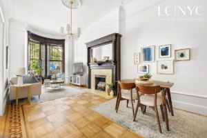 living room and dining room with fireplace in Upper West Side 1-bedroom